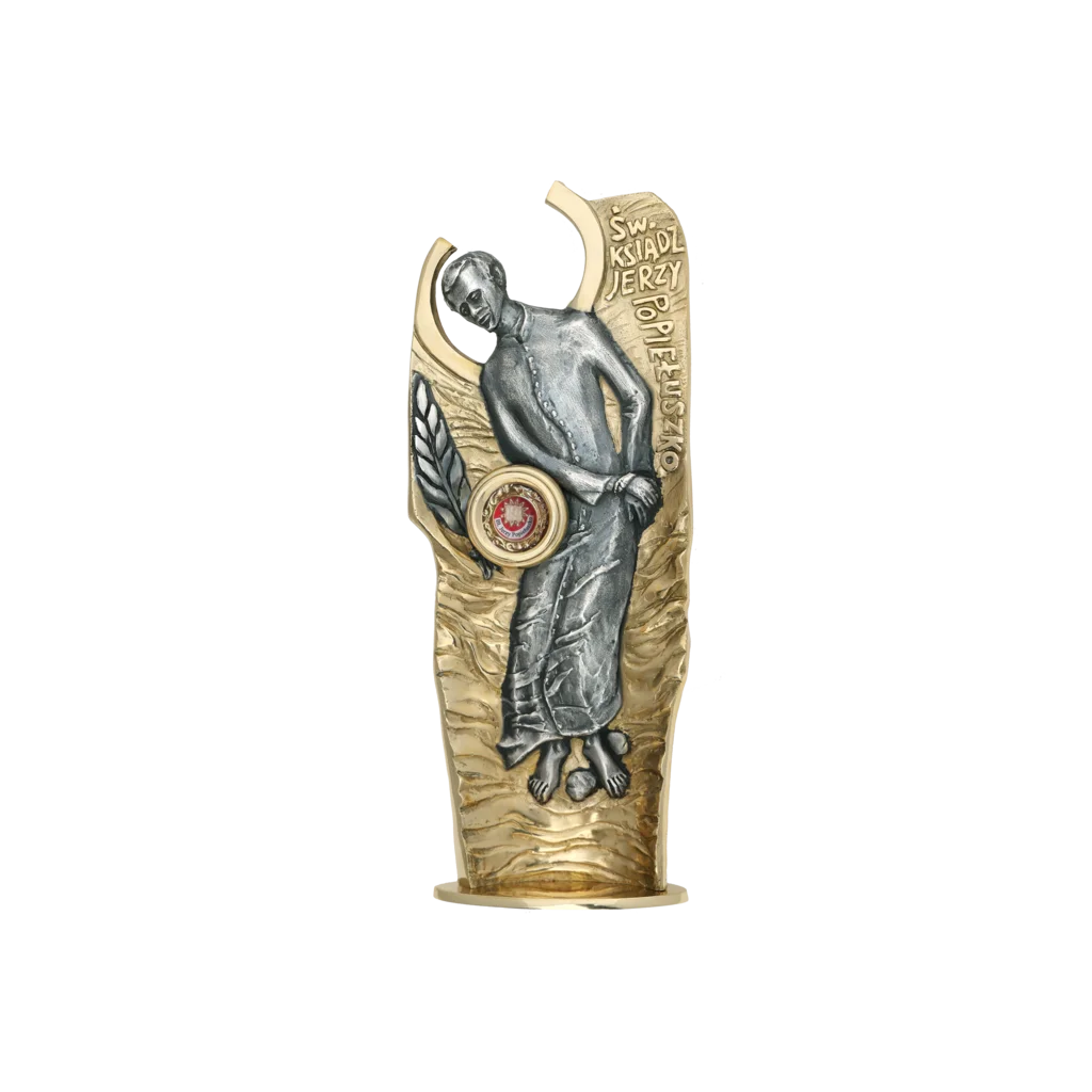 Relikwiarz bł. ks. Jerzego Popiełuszki – złocony, z kapsułą na relikwie, symbol męczeństwa i wiary.