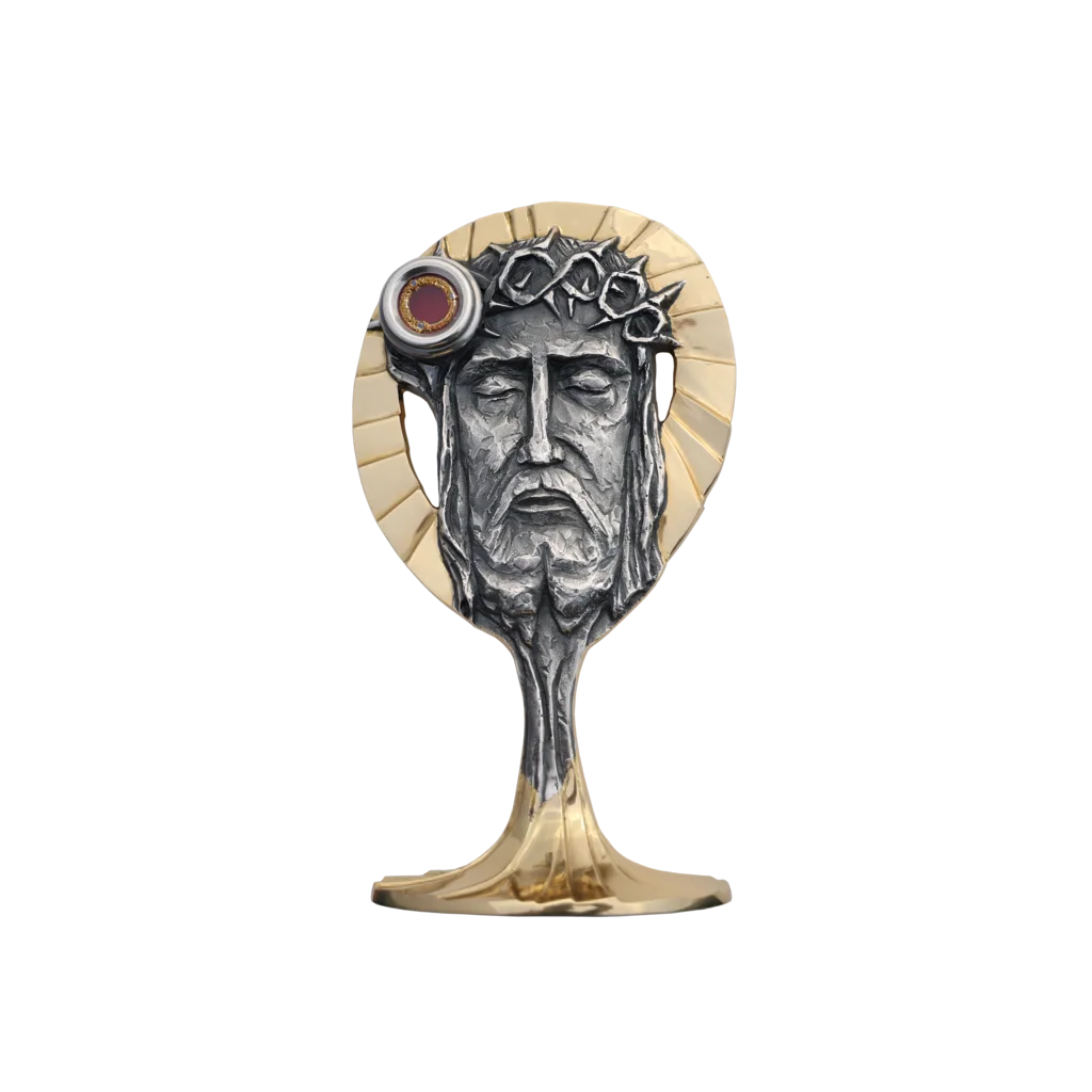 Relikwiarz z wizerunkiem Chrystusa w koronie cierniowej – symbol ofiary i zwycięstwa nad cierpieniem, złocony, z miejscem na relikwie.