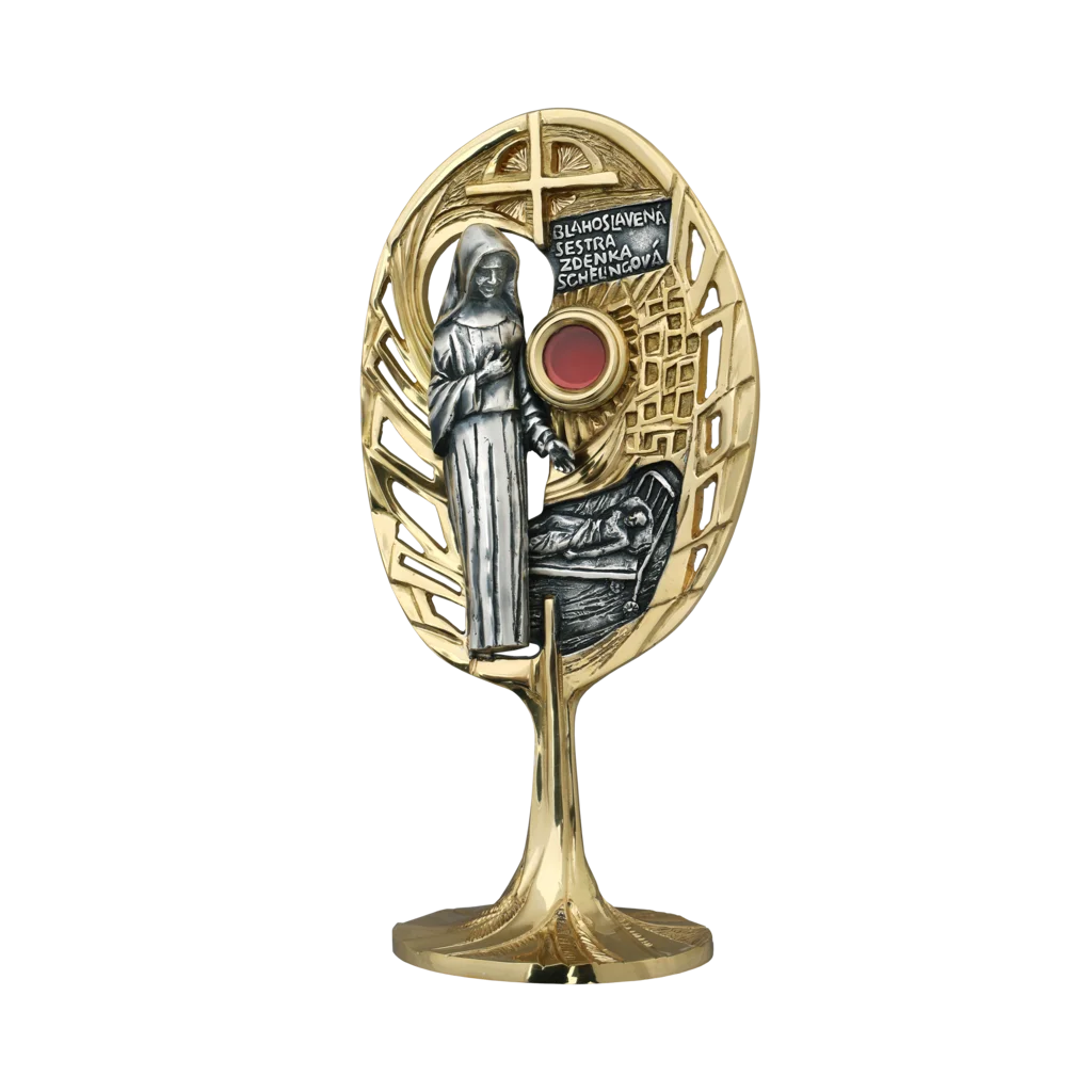 „Relikwiarz bł. Zdenki Schelingovej w złoconej oprawie liścia z krzyżem i sceną męczeństwa”